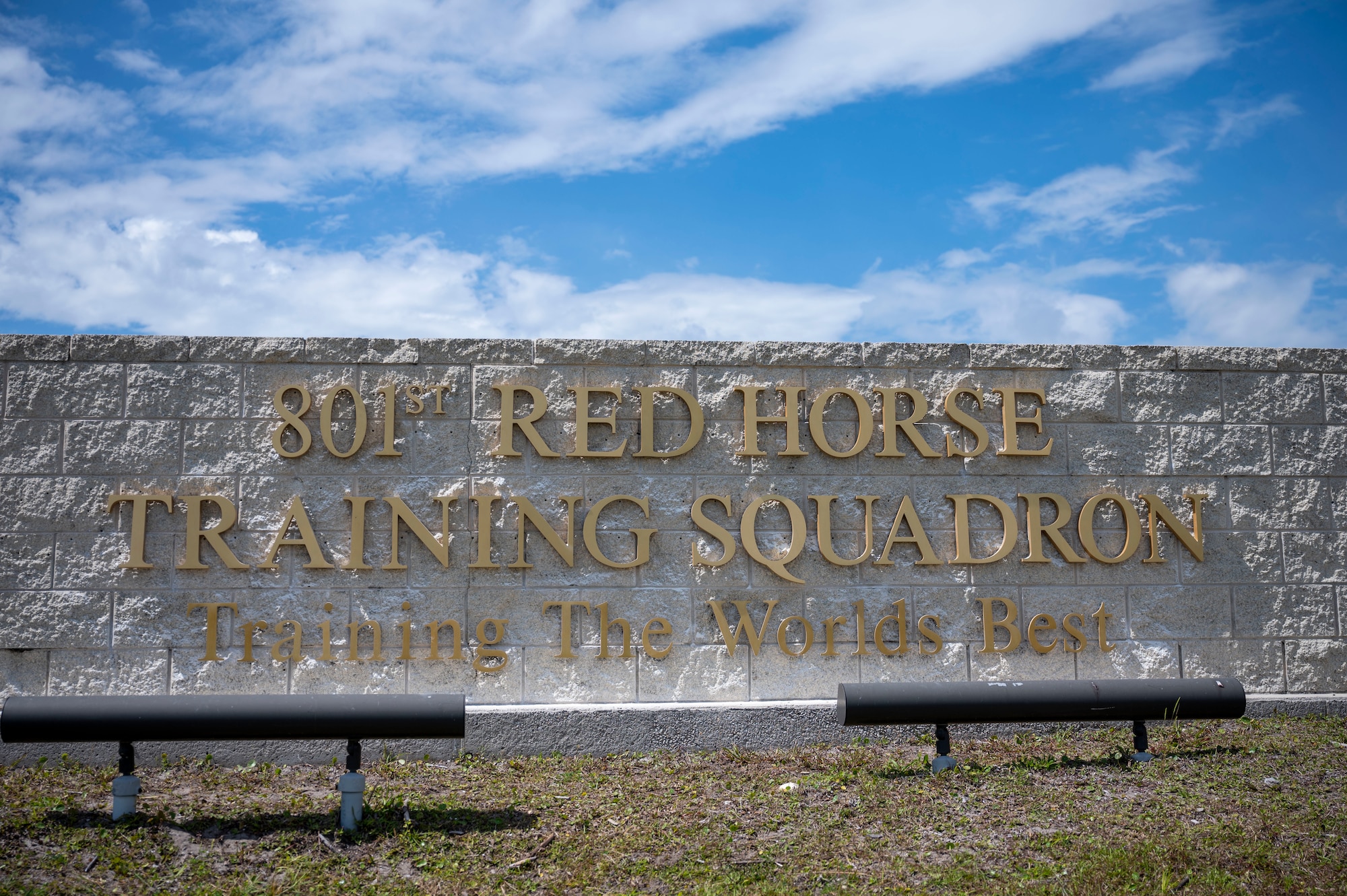 A sign identifying the 801st RED HORSE Training Squadron