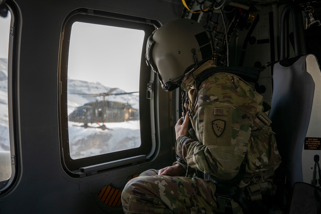 Alaska Army National Guardsmen with the 2-211th General Support Aviation Battalion travel from Joint Base Elmendorf-Richardson to Bethel, Alaska, via UH-60L Black Hawk helicopter April 11, 2022. The UH-60L Black Hawk helicopters will remain in Bethelfor Golf Company, Detachment 1, 2-211 GSAB to conduct annual training and aide in River Watch if needed this spring. Should there be significant flooding or other emergency in the vicinity, the helicopters will provide support as requested by the State. (Alaska National Guard photo by Spc. Grace Nechanicky)