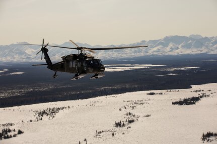 Alaska Army National Guardsmen with the 2-211th General Support Aviation Battalion travel from Joint Base Elmendorf-Richardson to Nome, Alaska, via UH-60L Black Hawk helicopter April 11, 2022. The UH-60L Black Hawk helicopters will remain in Nome for Golf Company, Detachment 1, 2-211th GSAB to conduct annual training and aide in River Watch if needed this spring. Should there be significant flooding or other emergency in the vicinity, the helicopters will provide support as requested by the State. (Alaska National Guard photo by 1st Lt. Balinda O’Neal)