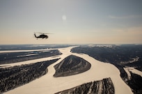 Alaska Army National Guardsmen with the 2-211th General Support Aviation Battalion travel from Joint Base Elmendorf-Richardson to Nome, Alaska, via UH-60L Black Hawk helicopter April 11, 2022. The UH-60L Black Hawk helicopters will remain in Nome for Golf Company, Detachment 1, 2-211th GSAB to conduct annual training and aide in River Watch if needed this spring. Should there be significant flooding or other emergency in the vicinity, the helicopters will provide support as requested by the State. (Alaska National Guard photo by 1st Lt. Balinda O’Neal)