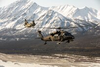 Alaska Army National Guardsmen with the 2-211th General Support Aviation Battalion travel from Joint Base Elmendorf-Richardson to Nome, Alaska, via UH-60L Black Hawk and CH-47 Chinook helicopters April 11, 2022. The CH-47 helicopter will bring the air crews back to JBER while the UH-60L Black Hawk helicopters remain in Nome for Golf Company, Detachment 1, 2-211th GSAB to conduct annual training and aide in River Watch if needed this spring. Should there be significant flooding or other emergency in the vicinity, the Black Hawk helicopters will provide support as requested by the State. (Alaska National Guard photo by 1st Lt. Balinda O’Neal)