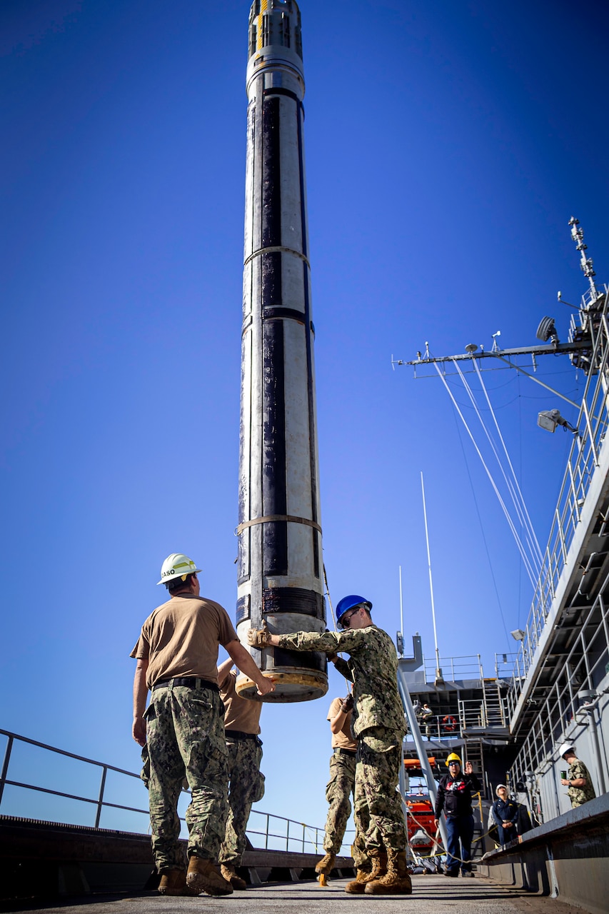 Sailors assigned to the Emory S. Land-class submarine tender USS Frank Cable (AS 40) guide an inert tomahawk missile training shape during an expeditionary rearming exercise with the Los Angeles-class fast-attack submarine USS Springfield (SSN 761) at HMAS Stirling Navy Base on Garden Island off the coast of Perth, Australia, April 24, 2022. Springfield is currently moored alongside Frank Cable conducting expeditionary rearming exercises with Frank Cable and the Royal Australian Navy. Frank Cable is currently on patrol conducting expeditionary maintenance and logistics in support of national security in the U.S. 7th Fleet area of operations.