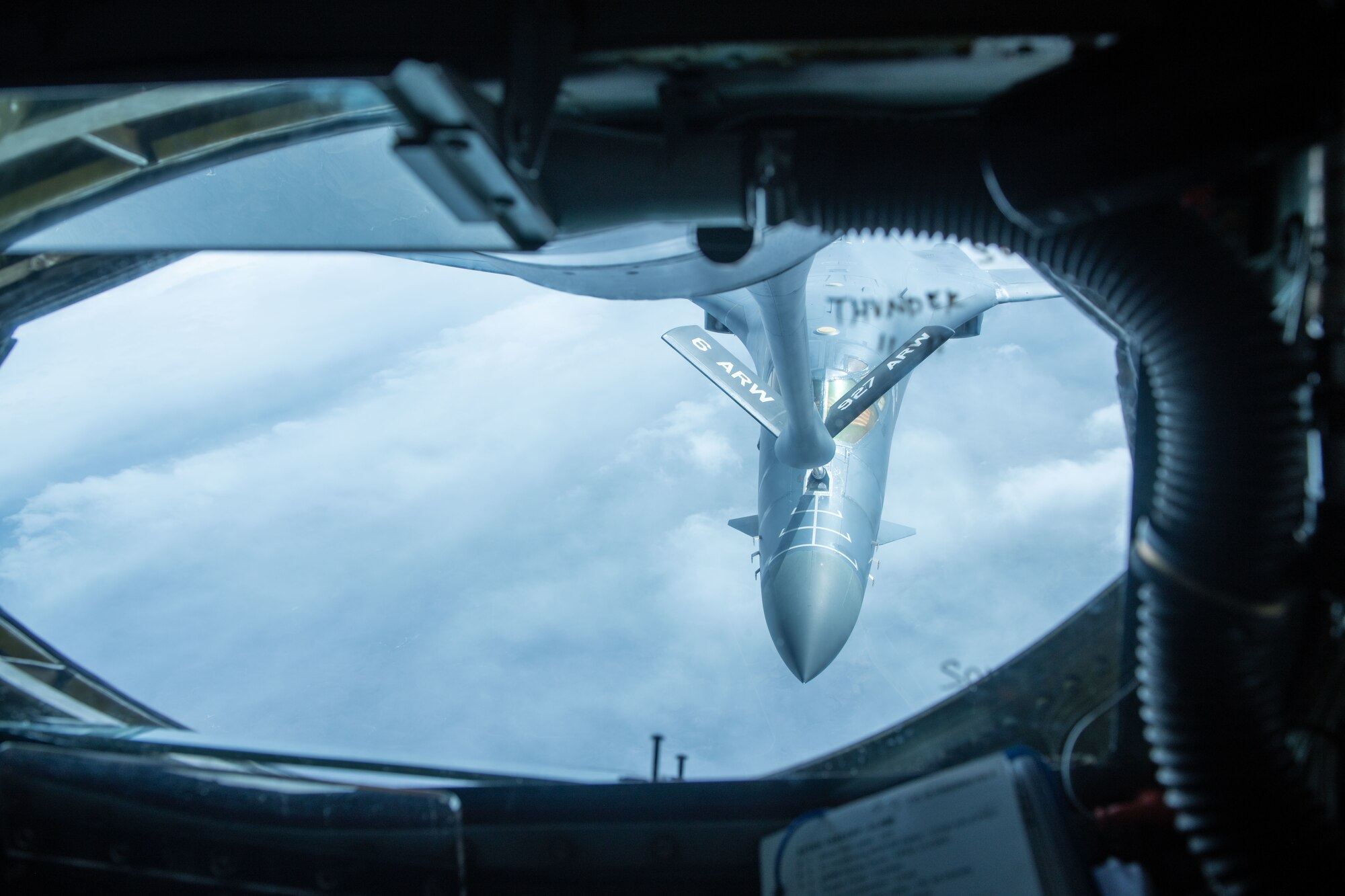 A B-1B Lancer refuels mid-flight from a KC-135 Stratotanker over the Powder River Training Complex, S.D., April 19, 2022. Air crews from Ellsworth Air Force Base and MacDill Air Force Base conducted airborne re-fueling exercises to mutually hone cooperative aviation skills. (U.S. Air Force photo by Airman 1st Class Adam Olson)