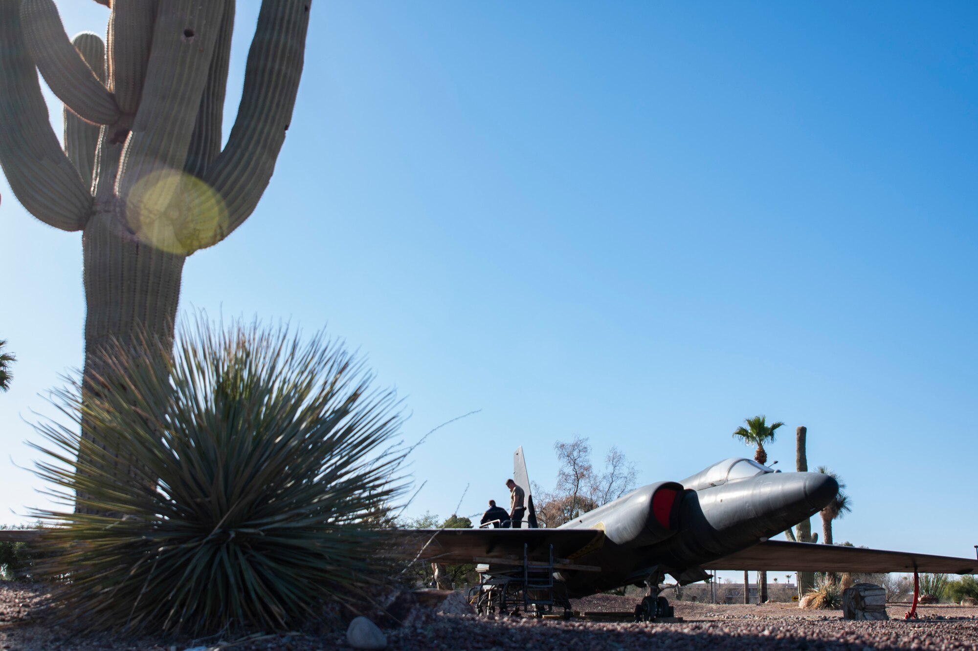 An aircraft is on display at a park.