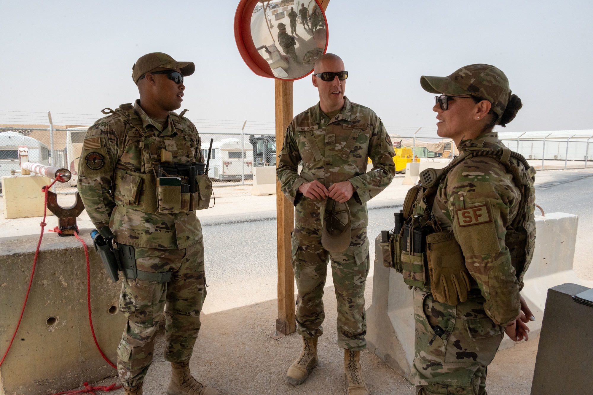U.S. Air Force Chief Master Sgt. Sean M. Milligan, 332d Air Expeditionary Wing command chief, visits 332nd Expeditionary Security Forces Squadron Airmen at a controlled entry point gate at an undisclosed location in Southwest Asia, April 23, 2022. Chief Milligan's immersion visits give him a better understanding of the unique skillsets every Airman brings to the 332d AEW Red Tail team. (U.S. Air Force photo by Tech. Sgt. Lauren M. Snyder)