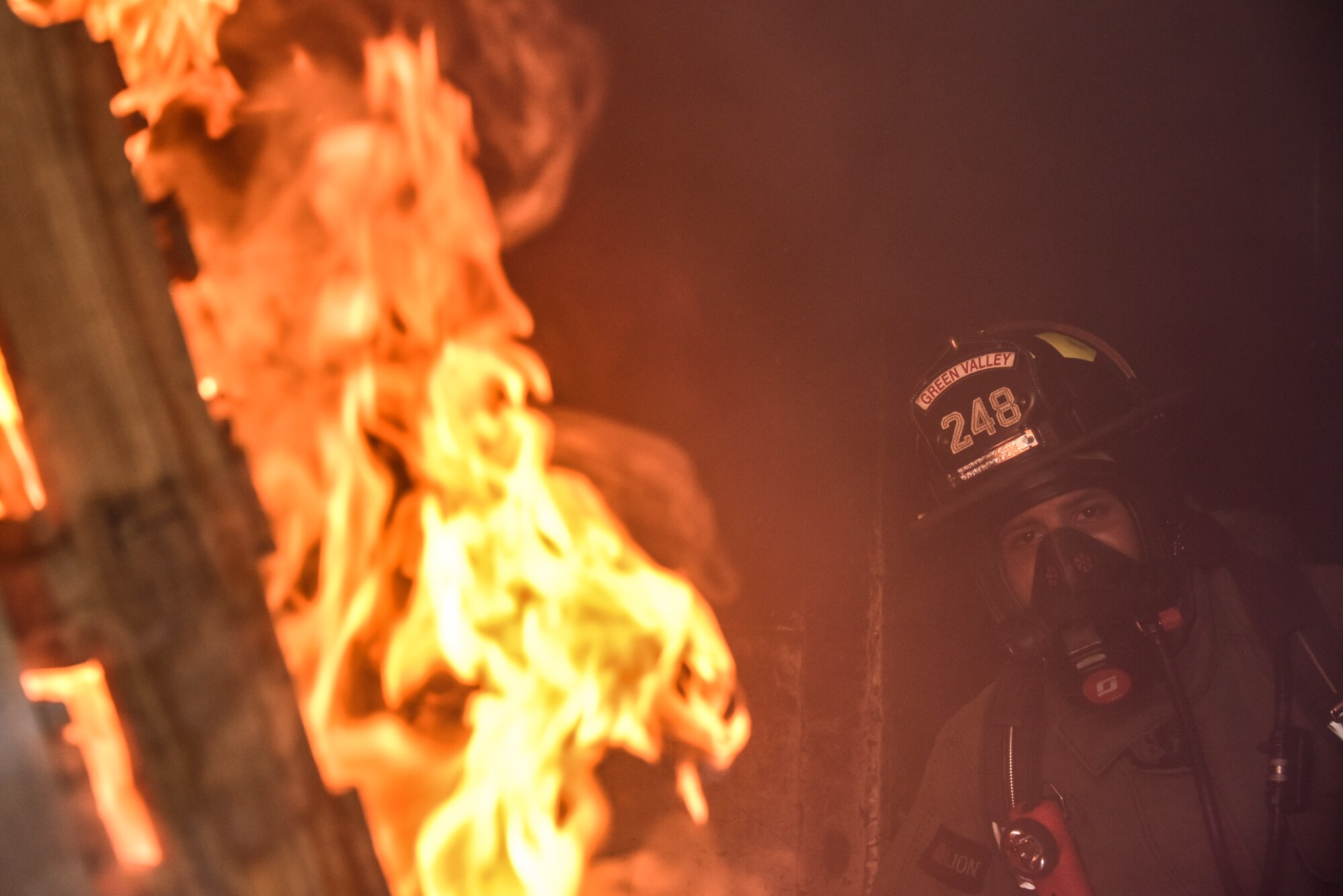 A photo of a firefighter fighting fire.