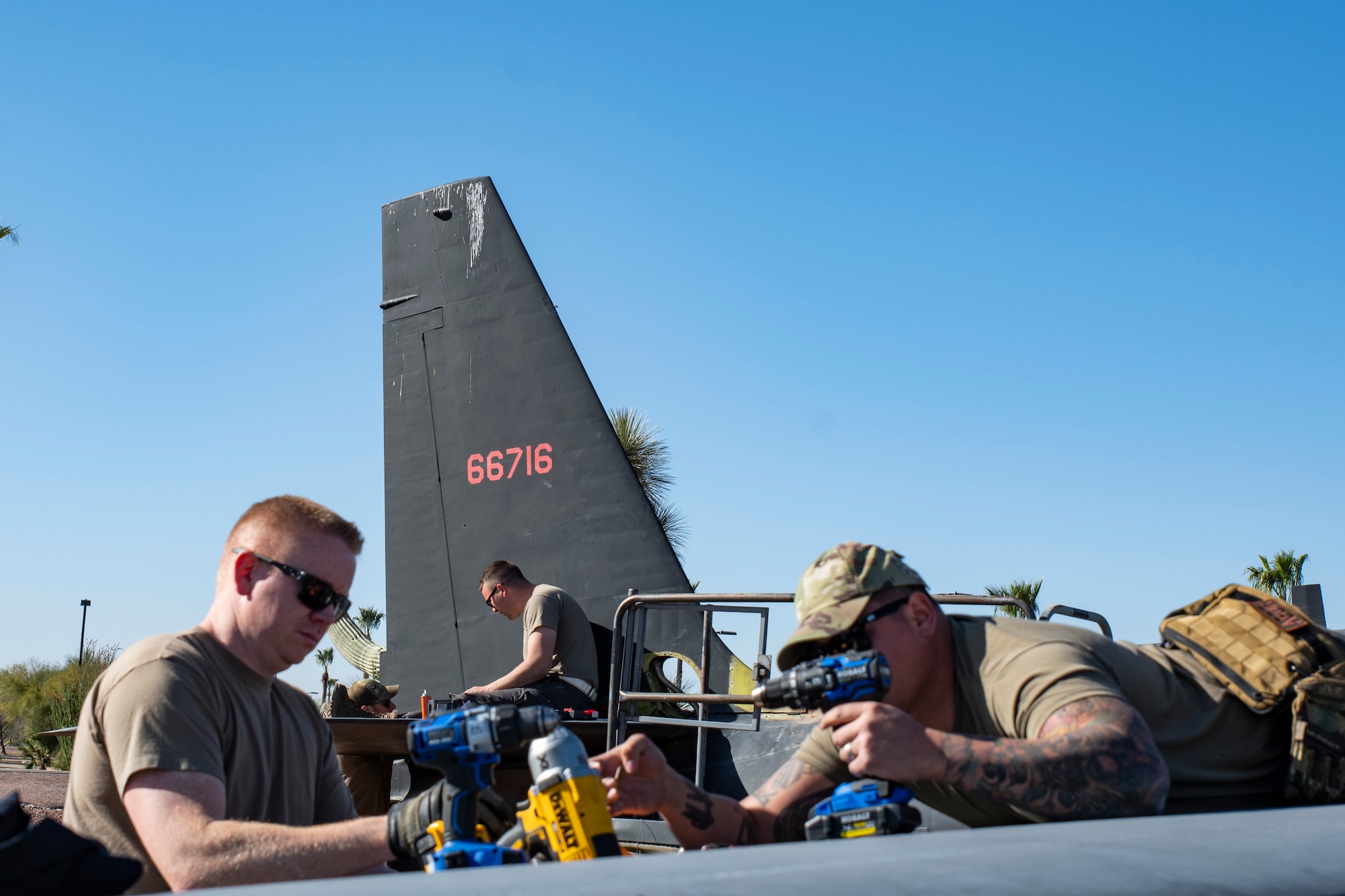 Airmen work on a aircraft.