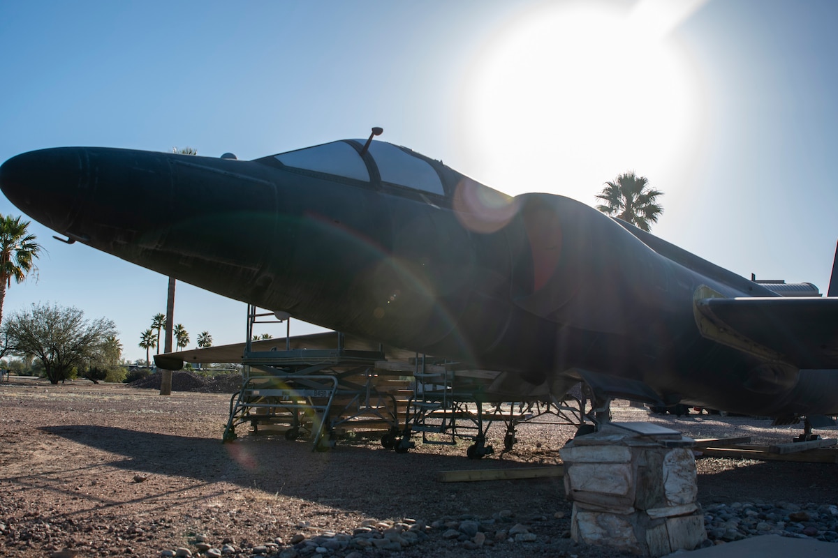 An aircraft is on display at a park.