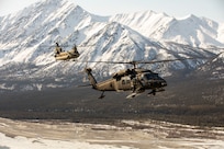 Alaska Army National Guardsmen with the 2-211th General Support Aviation Battalion travel from Joint Base Elmendorf-Richardson to Nome, Alaska, via UH-60L Black Hawk and CH-47 Chinook helicopters April 11, 2022. The CH-47 helicopter will bring the air crews back to JBER while the UH-60L Black Hawk helicopters remain in Nome for Golf Company, Detachment 1, 2-211th GSAB to conduct annual training and aide in River Watch if needed this spring. Should there be significant flooding or other emergency in the vicinity, the Black Hawk helicopters will provide support as requested by the State. (Alaska National Guard photo by 1st Lt. Balinda O’Neal)