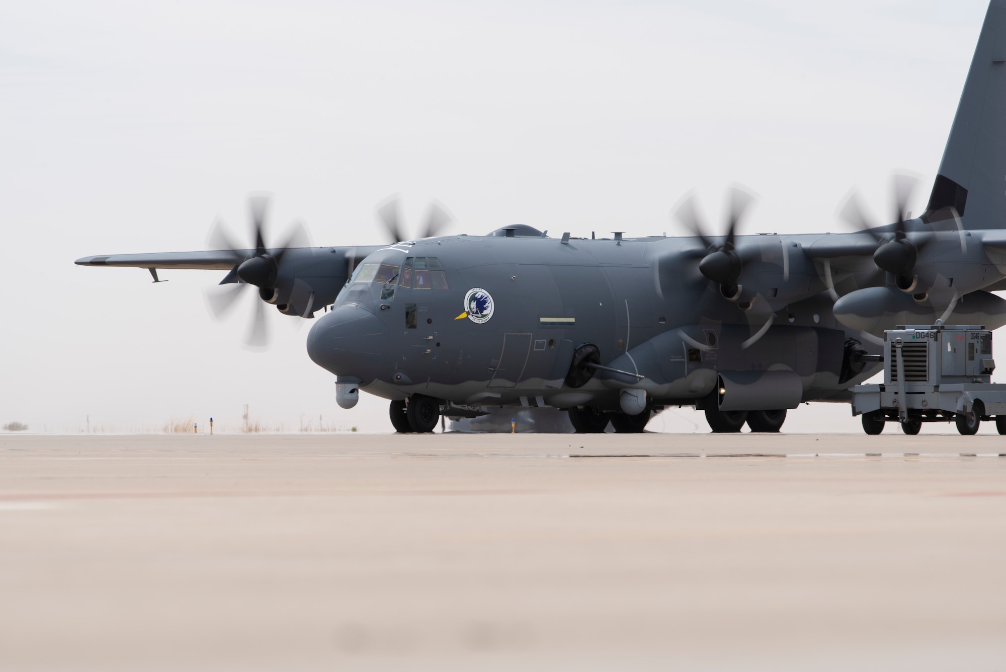 A U.S. Air Force 16th Special Operations Squadron AC-130J Ghostrider arrives at Cannon Air Force Base, New Mexico, April 18, 2022. The arrival of the AC-130J Ghostrider represents a significant expansion of force generation capacity as the Air Force Special Operations Command structures for the reemergence of great power competition, demanding significant transformation to ensure Air Commandos are ready to successfully operate in full-spectrum operations. (U.S. Air Force photo by Airman 1st Class Cassidy Thomas) (This photo has been altered for security purposes by blurring out identification numbers and equipment)
