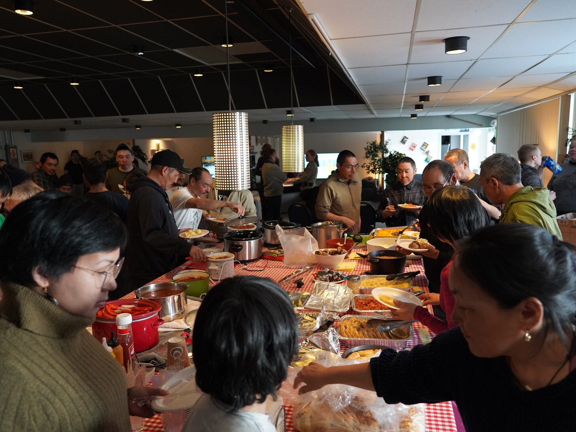 People eating a potluck dinner