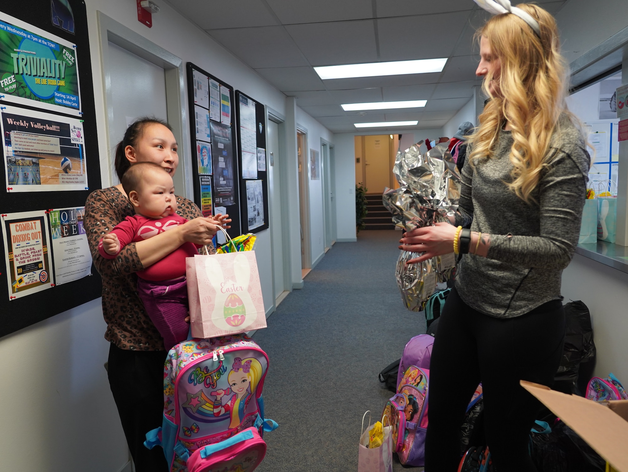 Airman providing supplies to local Greenlandic children