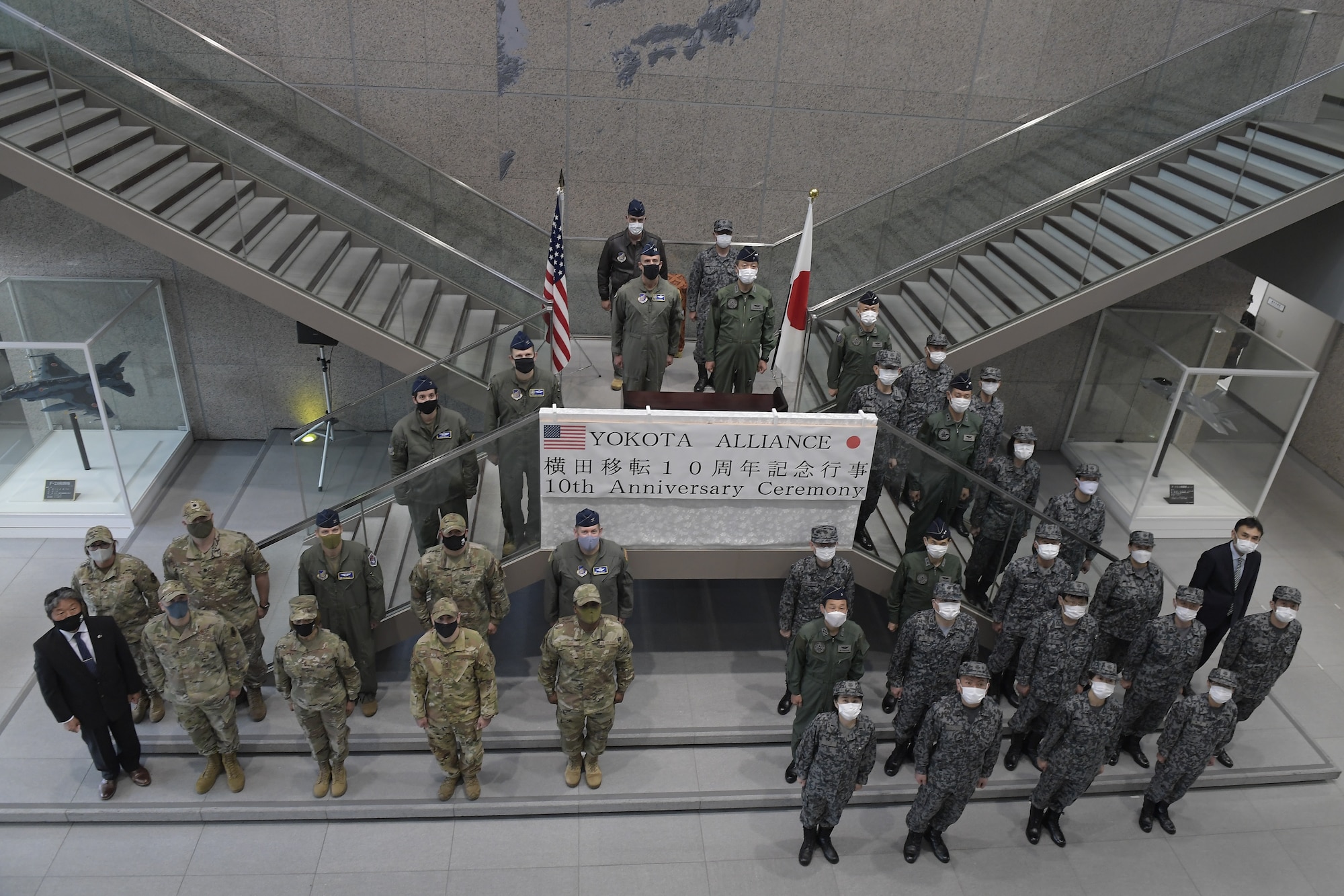 Japan Air Self Defense-Force (Koku-Jieitai), 5th Air Force and 374th Airlift Wing leadership pose for a photo during the 10th anniversary of JASDF relocation ceremony for the Air Defense Command at Yokota Air Base, Japan, April 20, 2022.