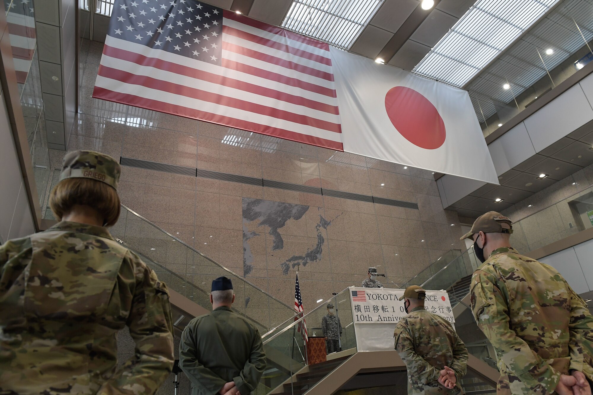 Japan Air Self-Defense Force (Koku-Jieitai) Col. Takashi Izuhara, Operations Support Wing commander, gives opening remarks at the 10th anniversary ceremony of the JASDF relocation of the Air Defense Command to Yokota Air Base, Japan, April 20, 2022.