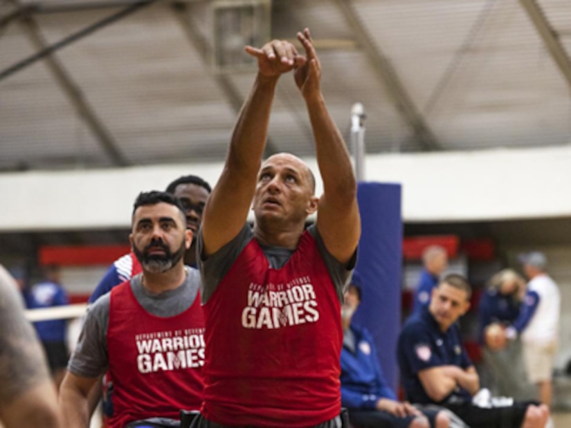 Retired U.S. Army Master Sgt. Earl Ohlinger prepares to compete in the 2022 Invictus Games by training in wheelchair basketball during the 2022 Invictus Games Team U.S. Training Camp, Fort Belvoir, Virginia, April 9, 2022. Team U.S is a part of more than 500 participants from 20 countries who will take part in The Invictus Games The Hague 2020 featuring ten adaptive sports, including archery, field, indoor rowing, powerlifting, swimming, track, sitting volleyball, wheelchair basketball, wheelchair rugby, and a driving challenge.