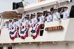 The commissioning crew of the Coast Guard Cutter Clarence Sutphin Jr., Patrol Forces Southwest Asia's sixth 154-foot Sentinel-class cutter, stand at attention as the ship is placed into service at a ceremony held at the Intrepid Sea, Air and Space Museum in New York City, April 21, 2022. The cutter's namesake is Boatswain's Mate 1st Class Clarence Sutphin Jr., a New York native who served in the U.S. Coast Guard from 1941 to 1945. During this time, Sutphin served as landing craft coxswain on board the attack transport USS Leonard Wood (APA 12), a landing craft supporting our troops in North Africa and Sicily. (U.S. Coast Guard photo by Petty Officer 3rd Class Ryan Schultz)