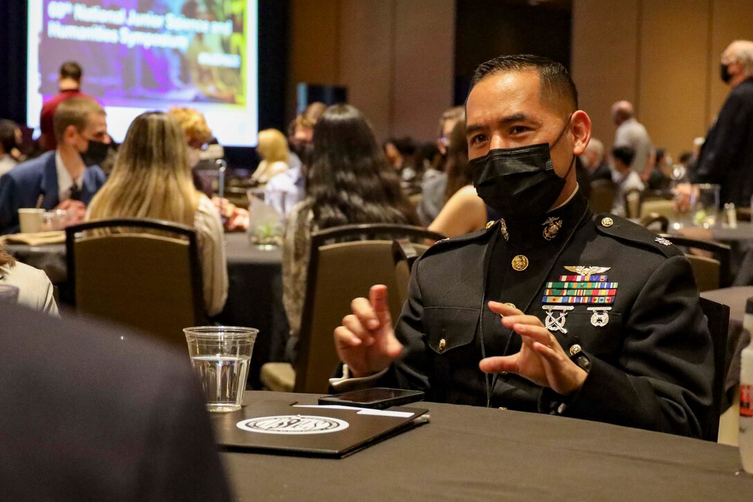 Lt. Col. Scotty Black, a Marine Officer currently attending the Naval Post Graduate School in Monterey, California, speaks with high school students at the National Junior Science and Humanities Symposium (NJSHS) in Albuquerque, New Mexico, Apr. 21, 2022. Black was a guest speaker and panel judge at the NJSHS, which is a Tri-Service program that encourages students to conduct original research in the fields of science, technology, engineering and mathematics (STEM). The NJSHS was sponsored by the Department of the Navy's Historically Black Colleges & Universities / Minority Institutions (HBCU/MI) Program, and provided a great opportunity for the Marine Corps to engage with and educate high-caliber students about the Marine Corps and its many opportunities.
