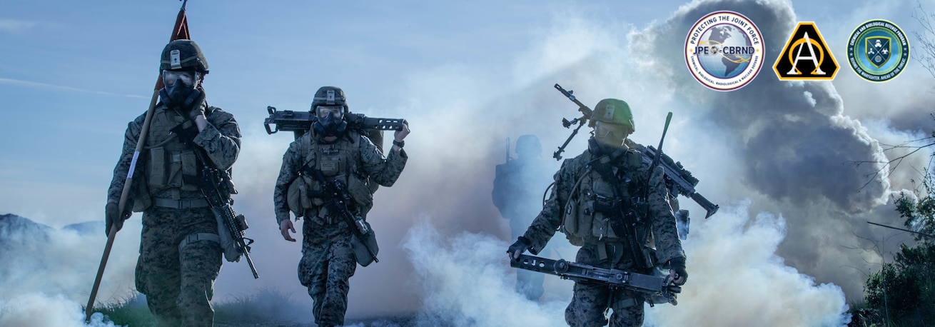 U.S. Marines from 1st Battalion, 1st Marine Regiment, 1st Marine Division hike through a simulated chemical attack at Marine Corps Base, Camp Pendleton, California