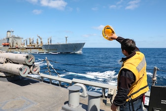 USS Ross (DDG 71) pulls away from USNS Laramie (T-AO 203) after a replenishment-at-sea in the Mediterranean Sea.