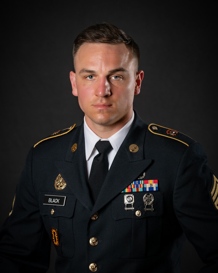 portrait of soldier or airman on a black background, waist up.