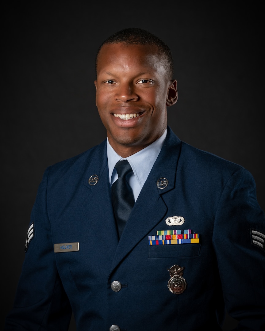 portrait of soldier or airman on a black background, waist up.