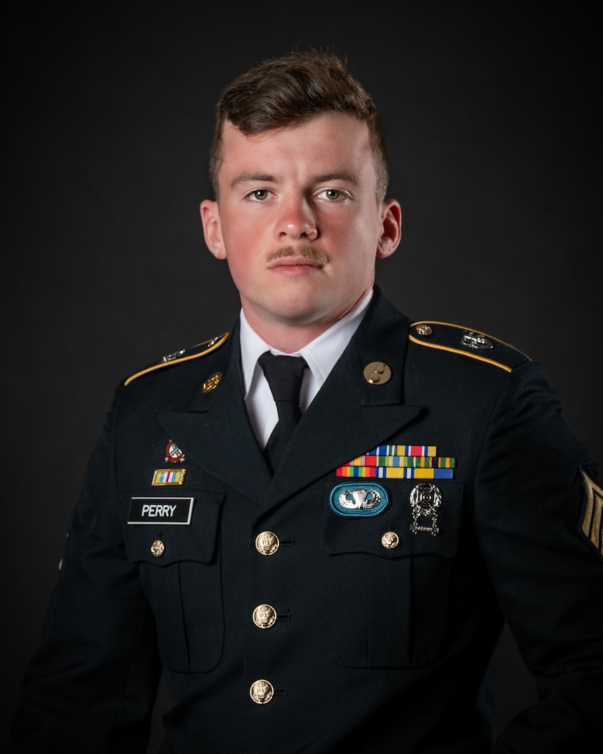 portrait of soldier or airman on a black background, waist up.