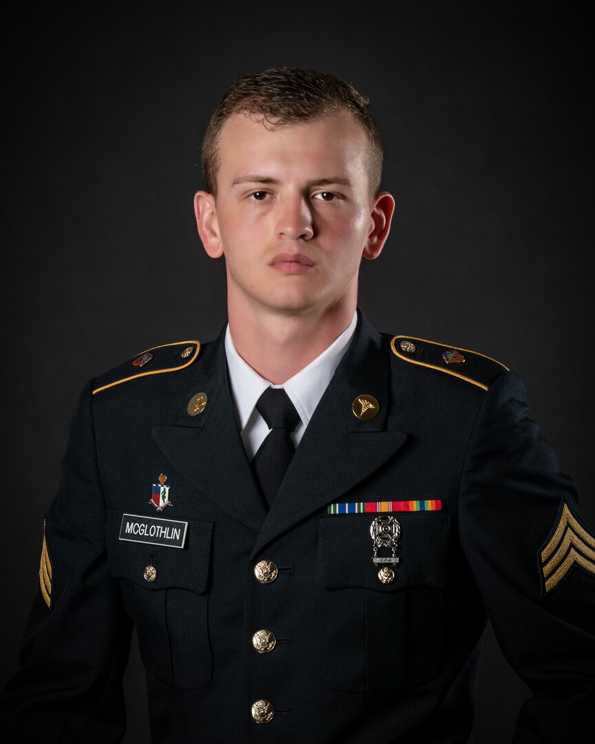 portrait of soldier or airman on a black background, waist up.