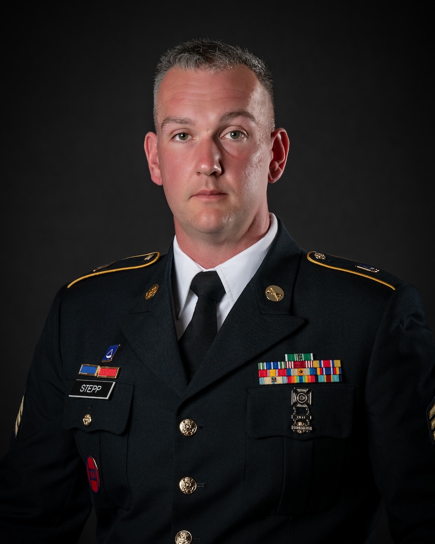 portrait of soldier or airman on a black background, waist up.