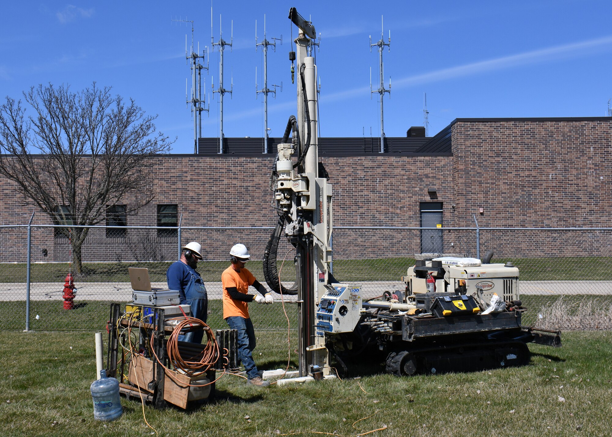 Drillers with Plains Environmental Services, Inc. conduct hydraulic profiling and electrical conductivity testing using a Geoprobe mobile drilling rig during a remedial investigation into the presence of Per- and Polyfluoroalkyl substances at Truax Field in Madison, Wisconsin, March 22, 2022. (U.S. Air National Guard photo by Senior Master Sgt. Paul Gorman)
