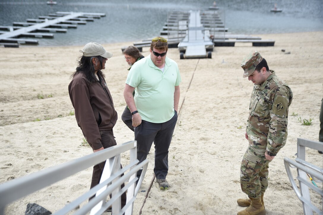 Left to right: Spring Shores Marina manager for Idaho Department of Parks and Recreation, Surat Nicol, Hydraulic Engineer for the Walla Walla District U.S. Corps of Engineers, Jon Roberts and LT Jack Marquez at Robie Creek Boat Ramp near Lucky Peak Dam in Idaho.