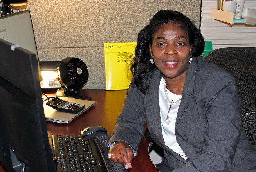 Dr. Michiel Sampson-Ford, director of the Internal Review Audit and Compliance Office, or IRACO, at U.S. Army Medical Logistics Command, is pictured in her office at Fort Detrick, Md. Dr. Sampson-Ford recently earned her Ph.D. in Business Administration, with an emphasis on finance and accounting, from Trident University International in Cypress, Calif.