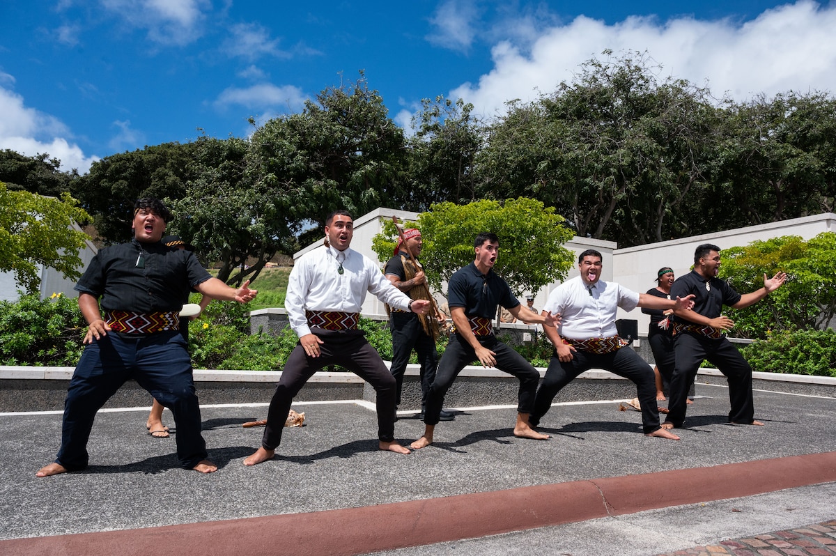 A group from the Polynesian Cultural Center perform the Haka in honor of Anzac, or Australian and New Zealand Army Corps, Day at the National Memorial Cemetery of the Pacific, Honolulu, Hawaii, April 25, 2022. The Haka is a ceremonial Māori war dance or challenge usually performed in a group and represent a display of a tribe's pride, strength and unity. (U.S. Air Force photo by Tech. Sgt. Hailey Haux)
