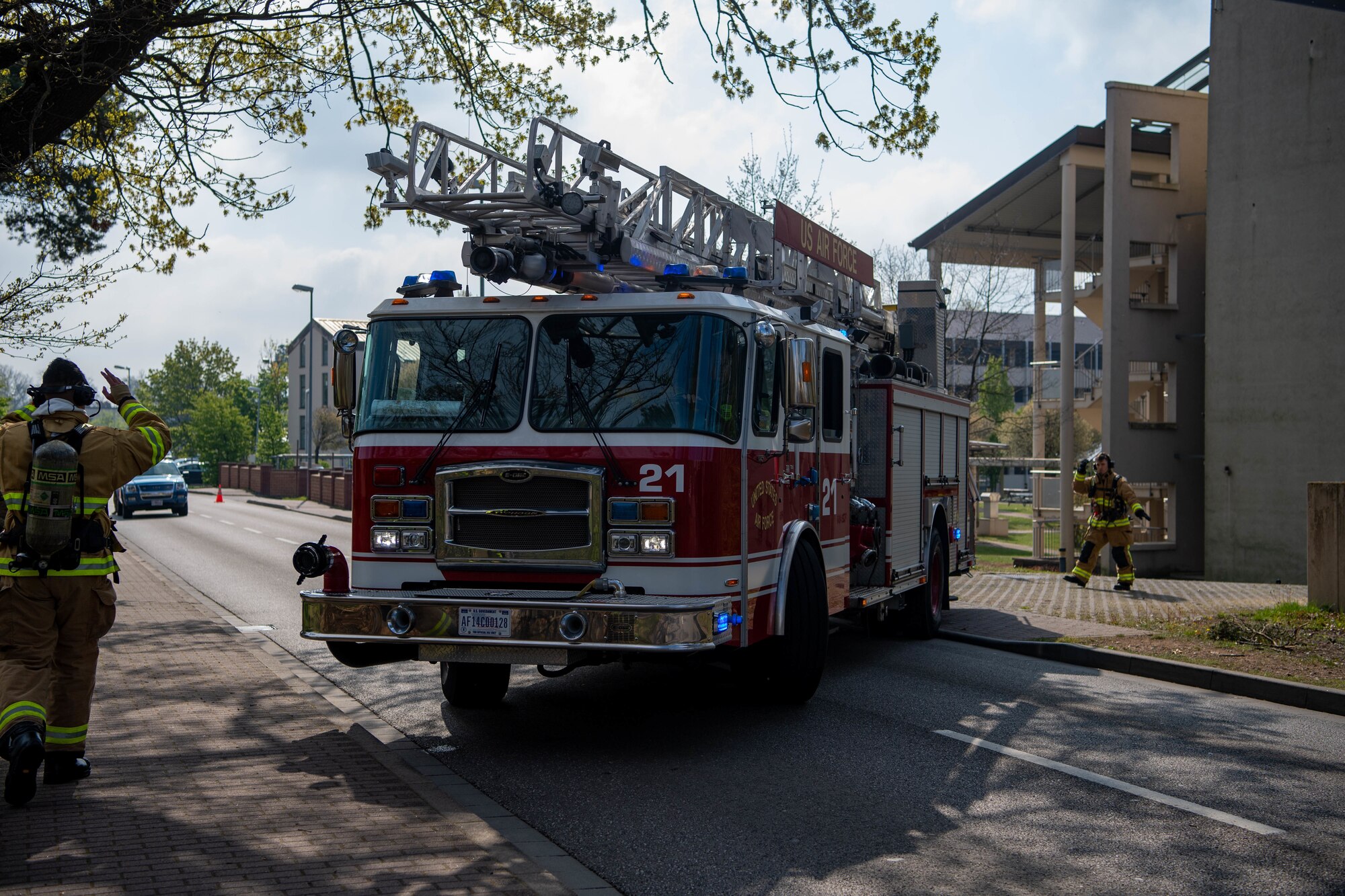 Firefighters guide fire truck