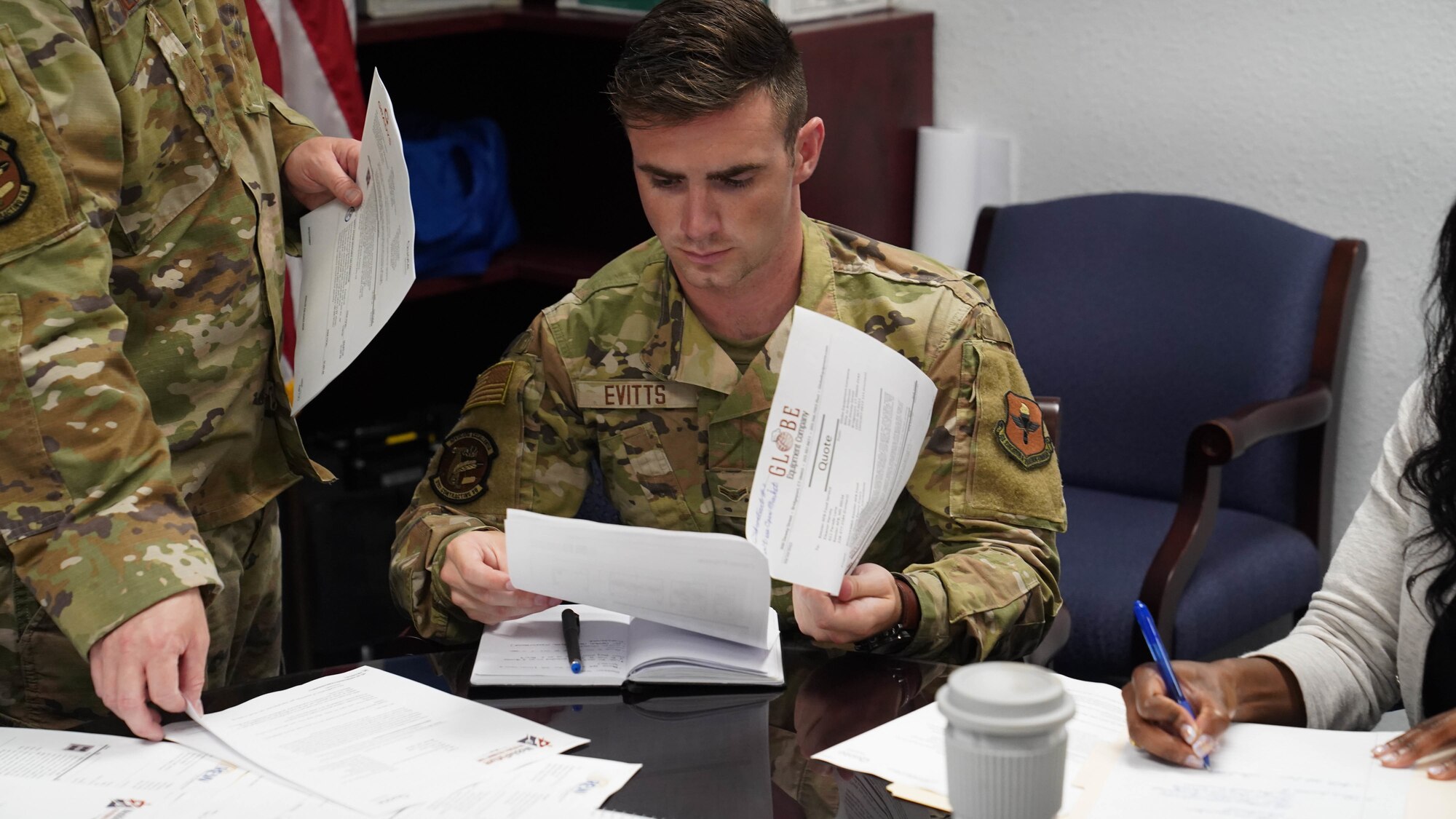 U.S. Air Force Airman 1st Class Andrew Evitts, 81st Contracting Squadron contract specialist, reads over a contract during the 81st CONS roadshow at Keesler Air Force Base, Mississippi, April 20, 2022. Members of the 81st CONS created the roadshow to improve processes and address an information gap between their staff and Keesler’s various units. (U.S. Air Force photo by Airman 1st Class Elizabeth Davis)