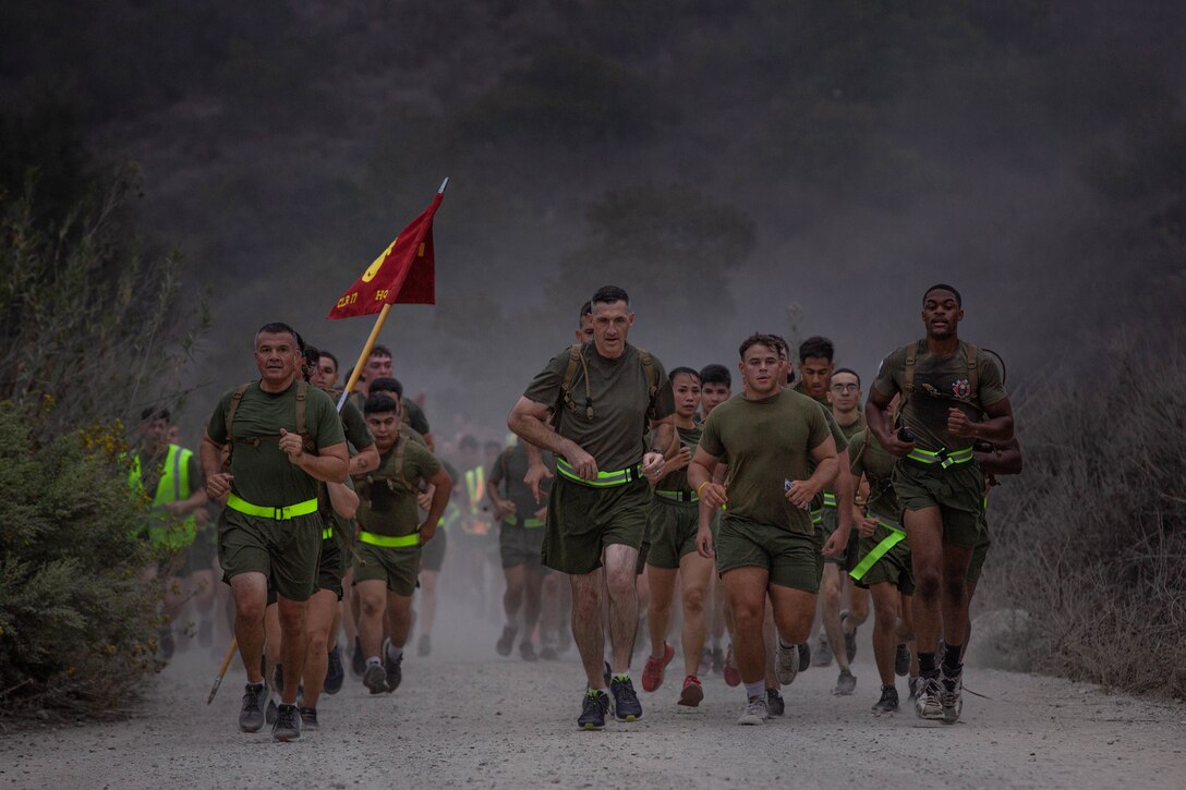U.S. Marines with Combat Logistics Regiment 17 conduct a 3 mile run on Camp Pendleton, Calif., Sept. 24, 2021. The formation run was held to boost morale and camaraderie throughout the regiment. (U.S. Marine Corps photo by Lance Cpl. Kristy Ordonez Maldonado)