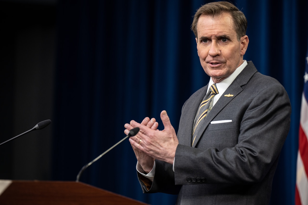 A man speaks from a podium.