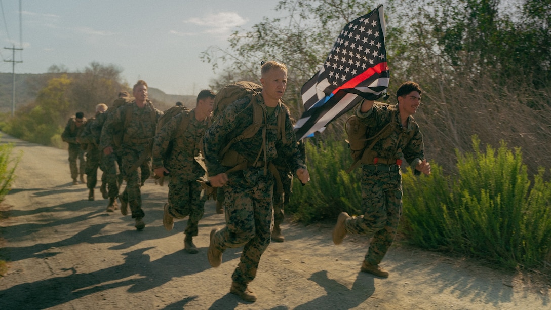 U.S. Marines with 7th Engineer Support Battalion, run to a checkpoint during a squad competition, at Marine Corps Base Camp Pendleton, Sep. 10, 2021. The Marines participated in the squad competition in remembrance of those affected by the 9/11 attacks. Throughout the competition, Marines were faced with obstacles intended to test the logistical warfighting capabilities of the unit. (U.S. Marine Corps photo by Cpl. William Redding)