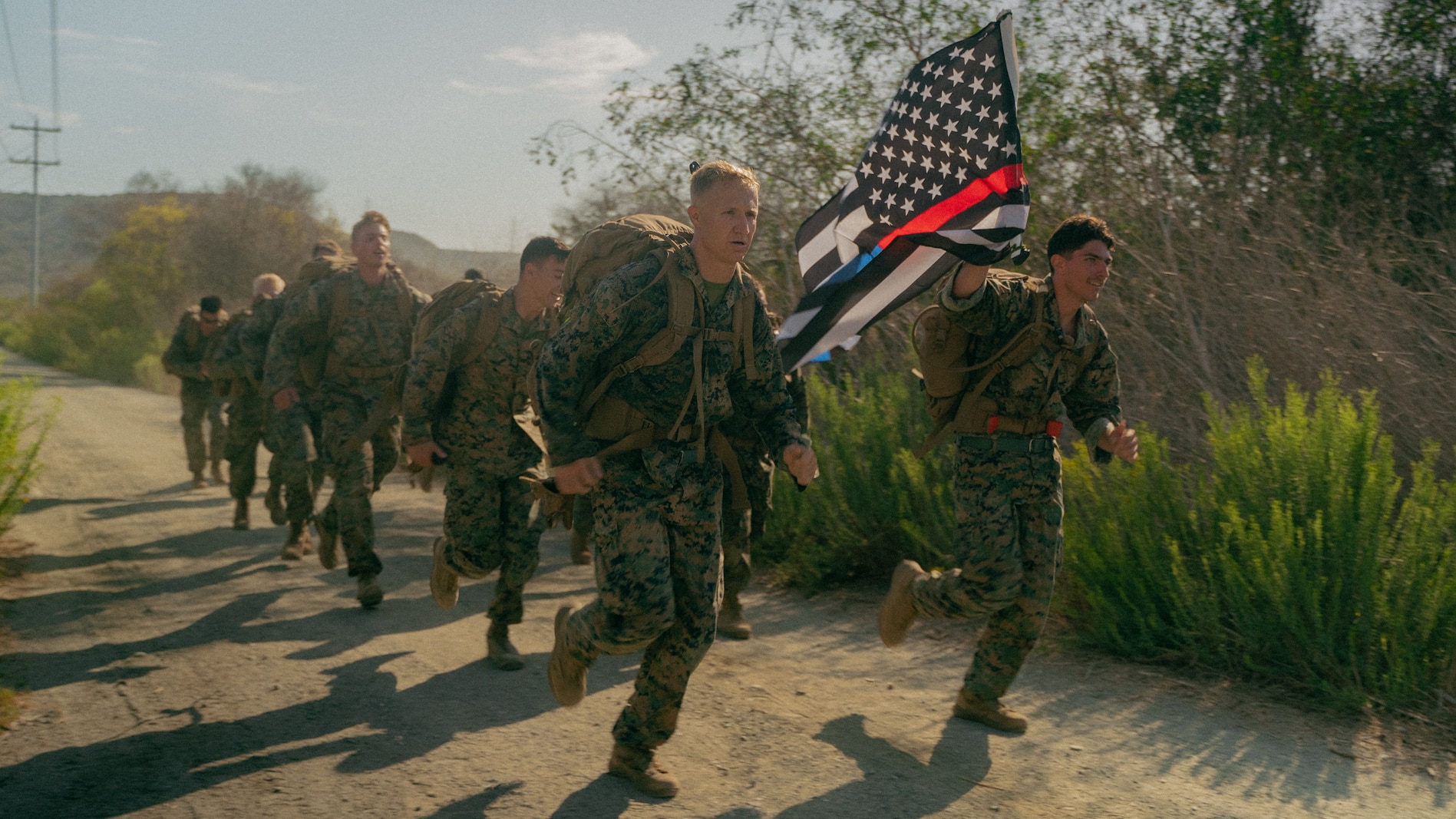 U.S. Marines with 7th Engineer Support Battalion, run to a checkpoint during a squad competition
