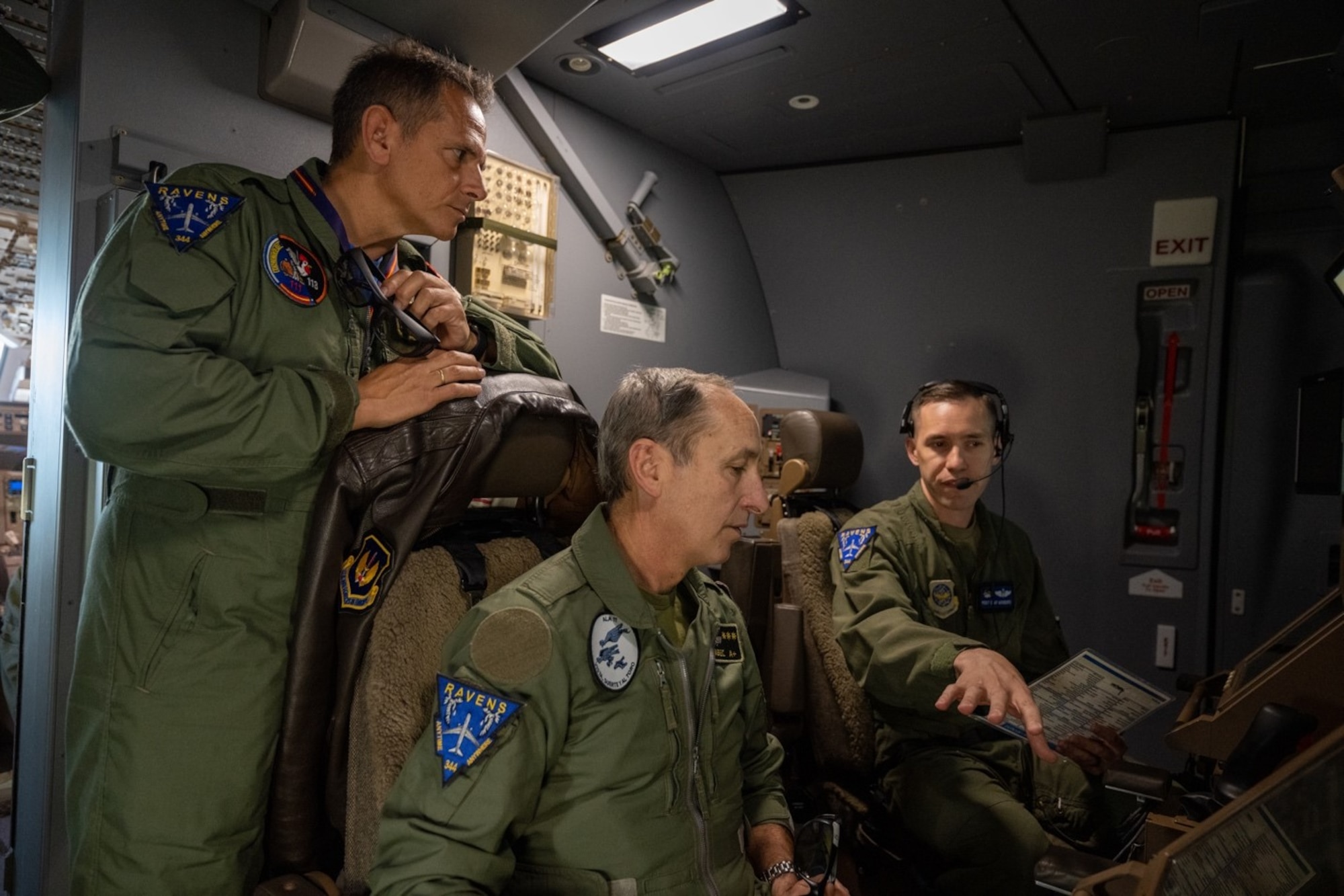 U.S. Air Force Master Sgt. Clay Wonders (right), KC-46A Employment Concept Exercise senior enlisted lead, explains boom station procedures to Spanish Air Force commanders Col. Enrique Fernandez Ambel, 11th Wing commander, and Lt. Col. Ignacio Zulueta Martin, 11th Eurofighter Group commander, during an orientation flight April 18, 2022. As a sign of camaraderie, the commanders were gifted patches from McConnell Air Force Base’s 344th Air Refueling Squadron. In solidarity, the Spanish commanders wore them for the duration of the flight. The mission provided an opportunity to build relations with the ECE’s Spanish hosts and showcase Pegasus capabilities in international operations.  (U.S. Air Force photo by Staff Sgt. Nathan Eckert)