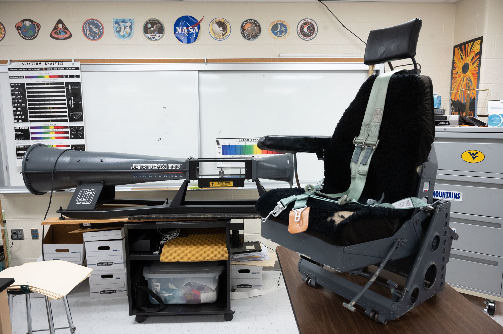 A aircraft seat from a C-130 E model sits on display in a classroom at Hurricane High School, Hurricane, West Virginia, April 26, 2022. The seat was donated to the Hurricane High Schools aerospace engineering class as an example of an aircraft seat designed for extended flight hours. (U.S. Air National Guard photo by Senior Master Sgt. Eugene Crist)