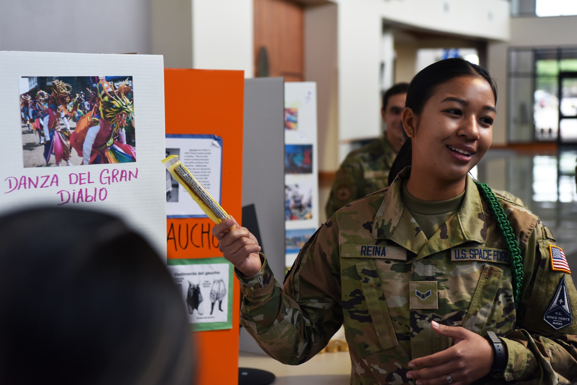 U.S. Space Force Spc. 3 Grace Reina, 316th Training Squadron student, shares stories about her home nation of Panama with attendees during the Goodfellow AFB and Angelo State University Language and Culture Fair, April 26, 2022, San Angelo, Texas. Reina shared her experiences with other Spanish speaking linguists, encouraging them to visit Panama and immerse themselves in its culture. (U.S. Air Force photo by Senior Airman Michael Bowman)