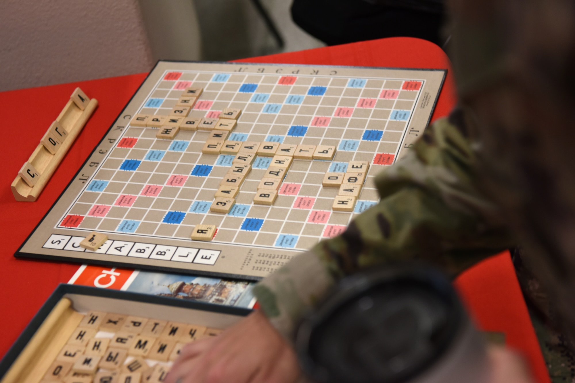 Members of the 17th Training Wing play word games using the Cyrillic alphabet at the Angelo State University and Goodfellow AFB Language and Culture Fair, April 26, 2022, San Angelo, Texas. The attendees learned about different languages and they experienced different cultures from where that language was spoken. (U.S. Air Force photo by Senior Airman Michael Bowman)