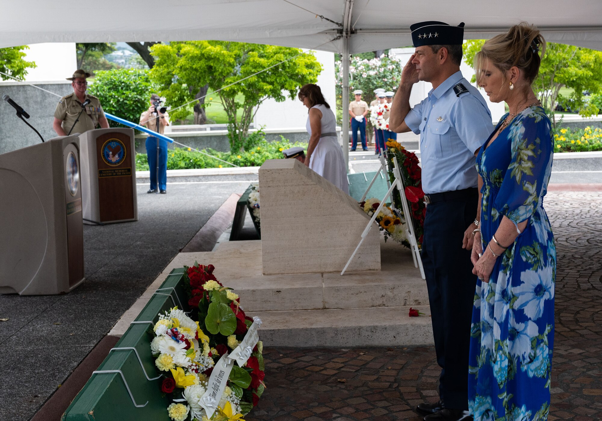 U.S. Air Force Gen. Ken Wilsbach, Pacific Air Forces commander, and Cindy Wilsbach, First Lady of PACAF, pay their respects after laying a wreath during Anzac, or Australian and New Zealand Army Corps, Day ceremony at the National Memorial Cemetery of the Pacific, Honolulu, Hawaii, April 25, 2022. More than 20 organizations—including the Consul-Generals of both Australia and New Zealand—laid wreaths in honor of Anzac Day. (U.S. Air Force photo by Tech. Sgt. Hailey Haux)