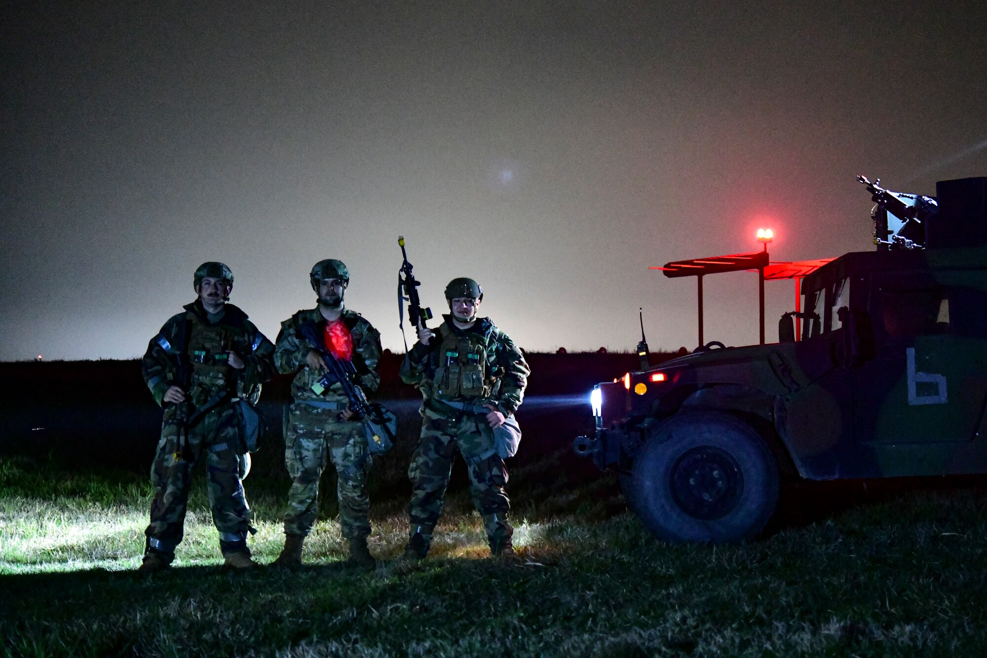 Airmen pose for a photo.