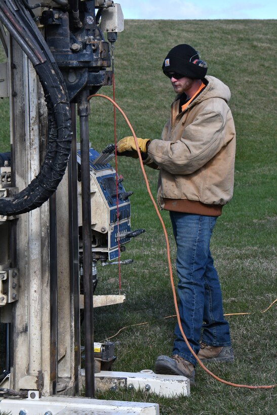 Drillers with Plains Environmental Services, Inc. conduct hydraulic profiling and electrical conductivity testing using a Geoprobe mobile drilling rig during a remedial investigation into the presence of Per- and Polyfluoroalkyl substances at Truax Field in Madison, Wisconsin, March 22, 2022. (U.S. Air National Guard photo by Senior Master Sgt. Paul Gorman)