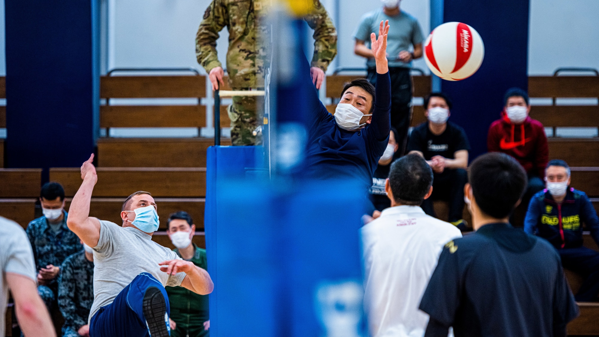Members from Team Misawa playing in a volleyball game.