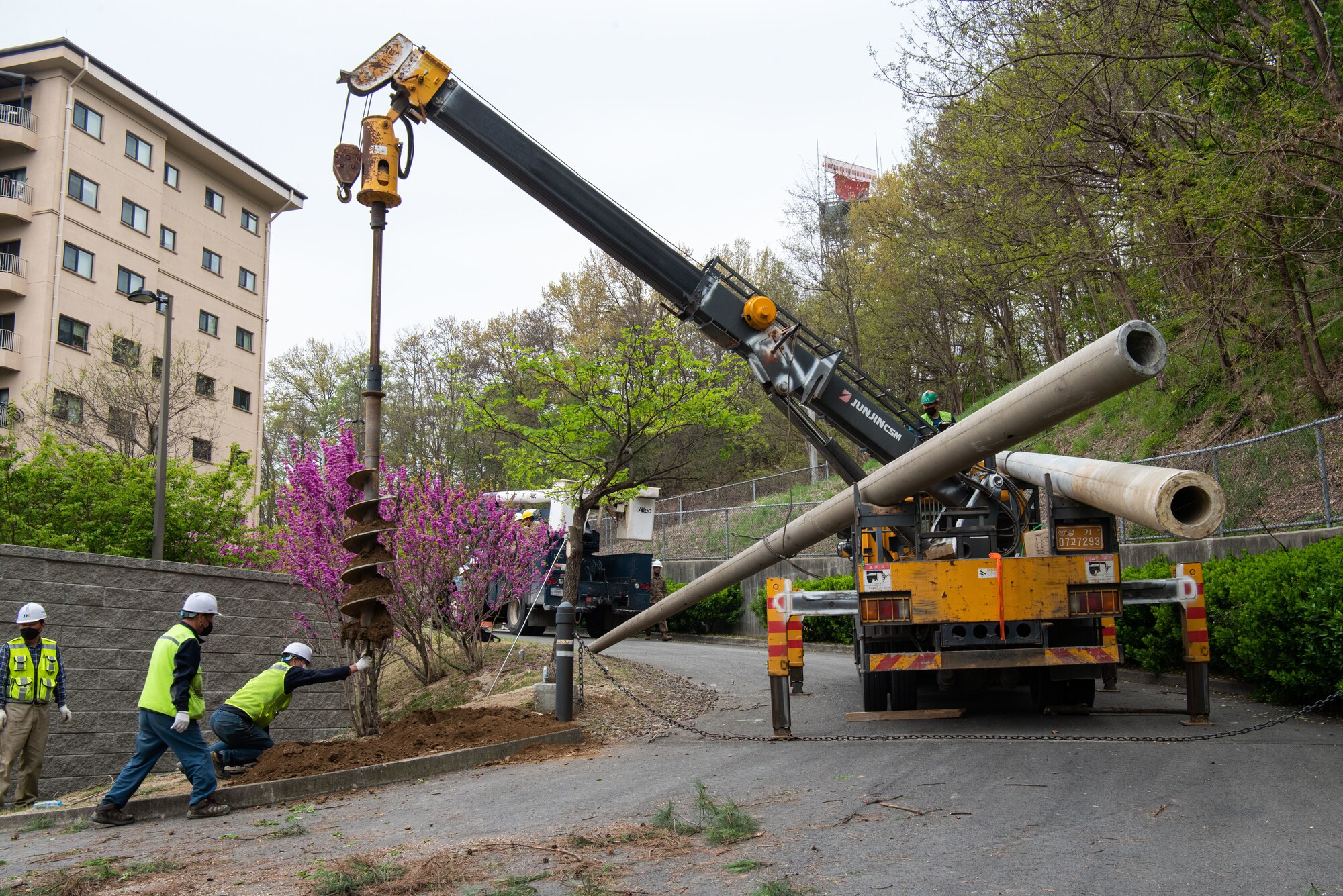 Contractors help conduct powerline reconstruction at Osan Air Base, Republic of Korea, April 22, 2022.