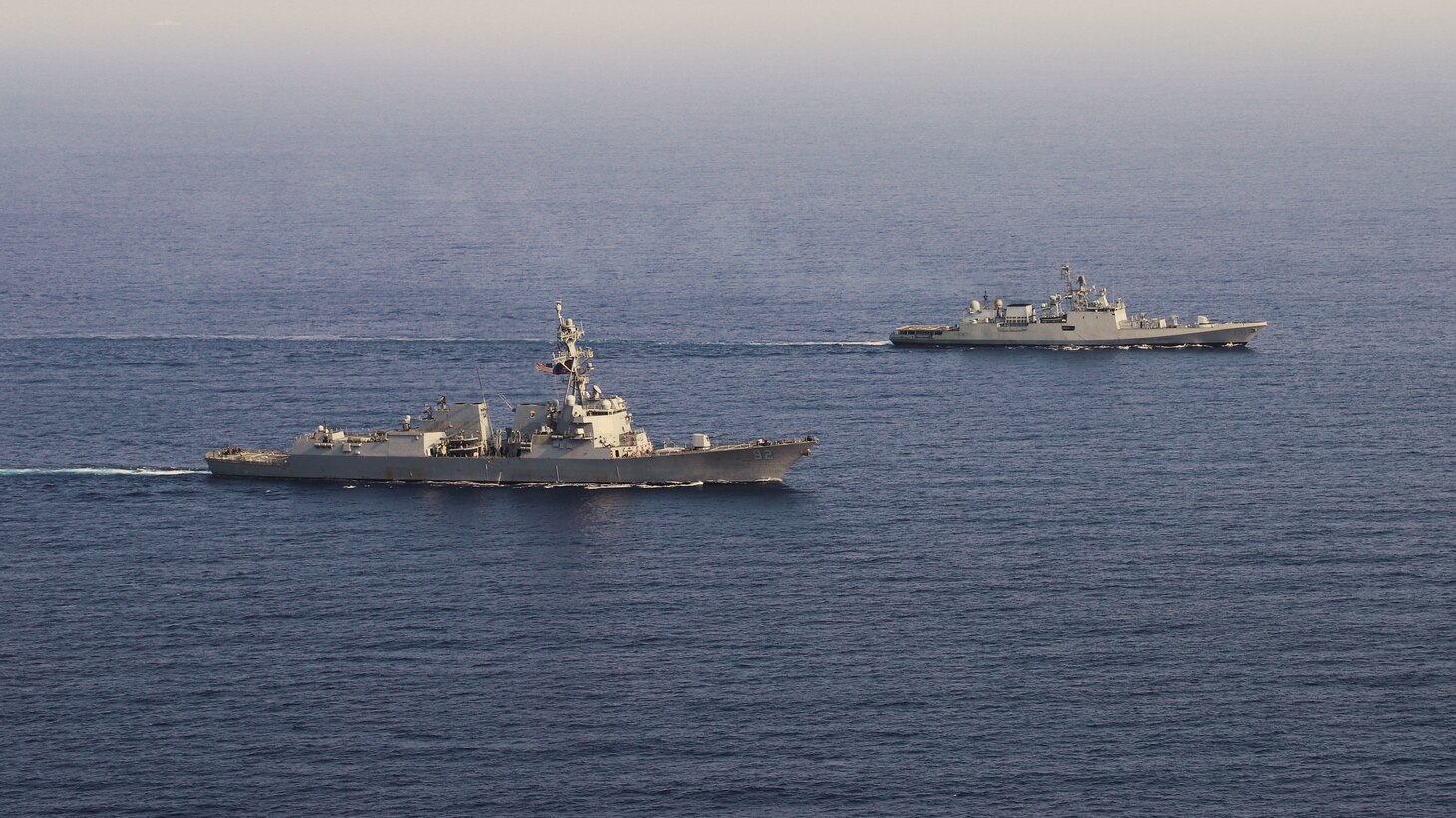 220427-N-TT059-2141 ARABIAN SEA (Apr. 27, 2022) The Arleigh Burke-class guided-missile destroyer USS Momsen (DDG 92) conducts a bilateral training exercise with the Indian Navy's guided-missile frigate INS Trishul (F 43). USS Momsen is assigned to Commander, Task Force 71/Destroyer Squadron (DESRON) 15, the Navy's largest forward-deployed DESRON and the U.S. 7th Fleet's principal surface force, and is underway supporting a free and open Indo-Pacific. (U.S. Navy photo by Naval Air Crewman (Helicopter) 2nd Class Regnor Vondedenroth)