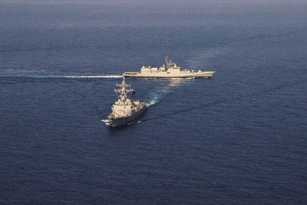 220427-N-TT059-2100 ARABIAN SEA (Apr. 27, 2022) The Arleigh Burke-class guided-missile destroyer USS Momsen (DDG 92) conducts a bilateral training exercise with the Indian Navy's guided-missile frigate INS Trishul (F 43). USS Momsen is assigned to Commander, Task Force 71/Destroyer Squadron (DESRON) 15, the Navy's largest forward-deployed DESRON and the U.S. 7th Fleet's principal surface force, and is underway supporting a free and open Indo-Pacific. (U.S. Navy photo by Naval Air Crewman (Helicopter) 2nd Class Regnor Vondedenroth)