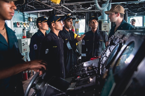 220427-N-TT059-1130 ARABIAN SEA (Apr. 27, 2022) Indian Navy sailors tour the bridge aboard the Arleigh Burke-class guided-missile destroyer USS Momsen (DDG 92) during a bilateral training exercise with the Indian Navy's guided-missile frigate INS Trishul (F 43). USS Momsen is assigned to Commander, Task Force 71/Destroyer Squadron (DESRON) 15, the Navy's largest forward-deployed DESRON and the U.S. 7th Fleet's principal surface force, and is underway supporting a free and open Indo-Pacific. (U.S. Navy photo by Mass Communication Specialist 3rd Class Lily Gebauer)